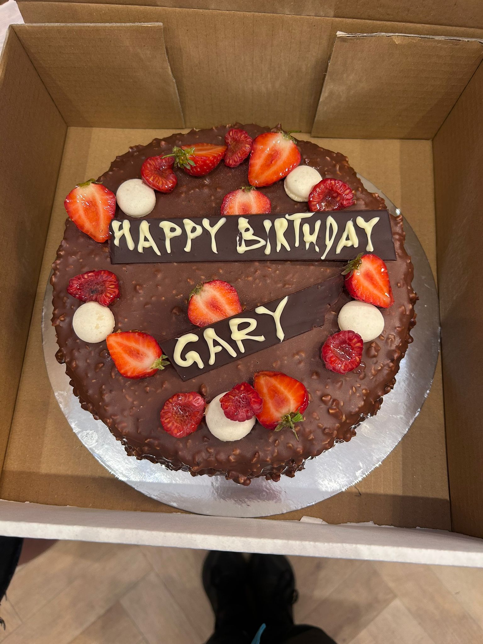 Chocolate celebration cake with fresh strawberries