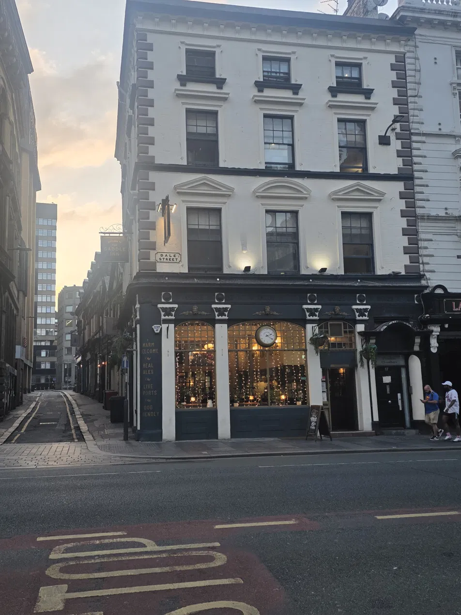The Saddle Inn on Dale Street at sunset, showing Victorian pub façade with ornate cast iron detailing