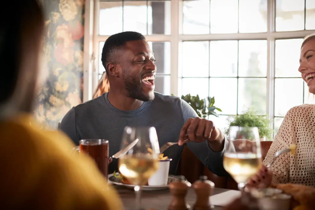 Friends meeting for a meal in a traditional English pub