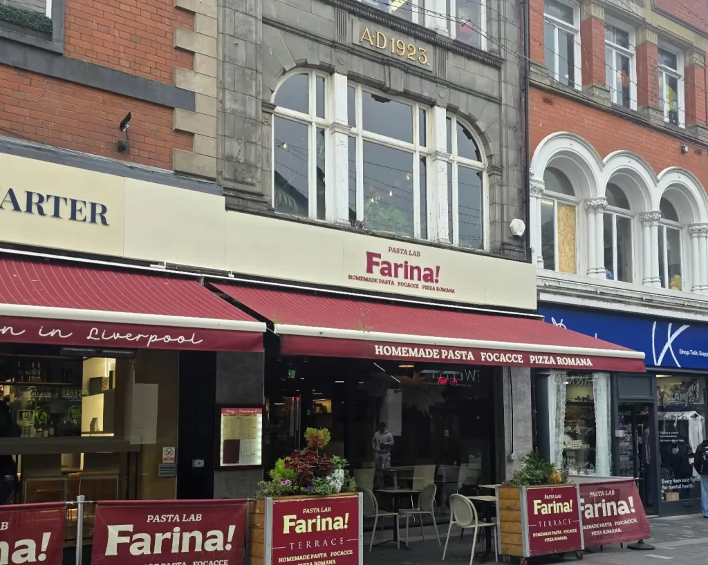 Farina! Pasta Lab on the Italian Quarter terrace in Liverpool city centre, beneath a stone facade dated A.D. 1923
